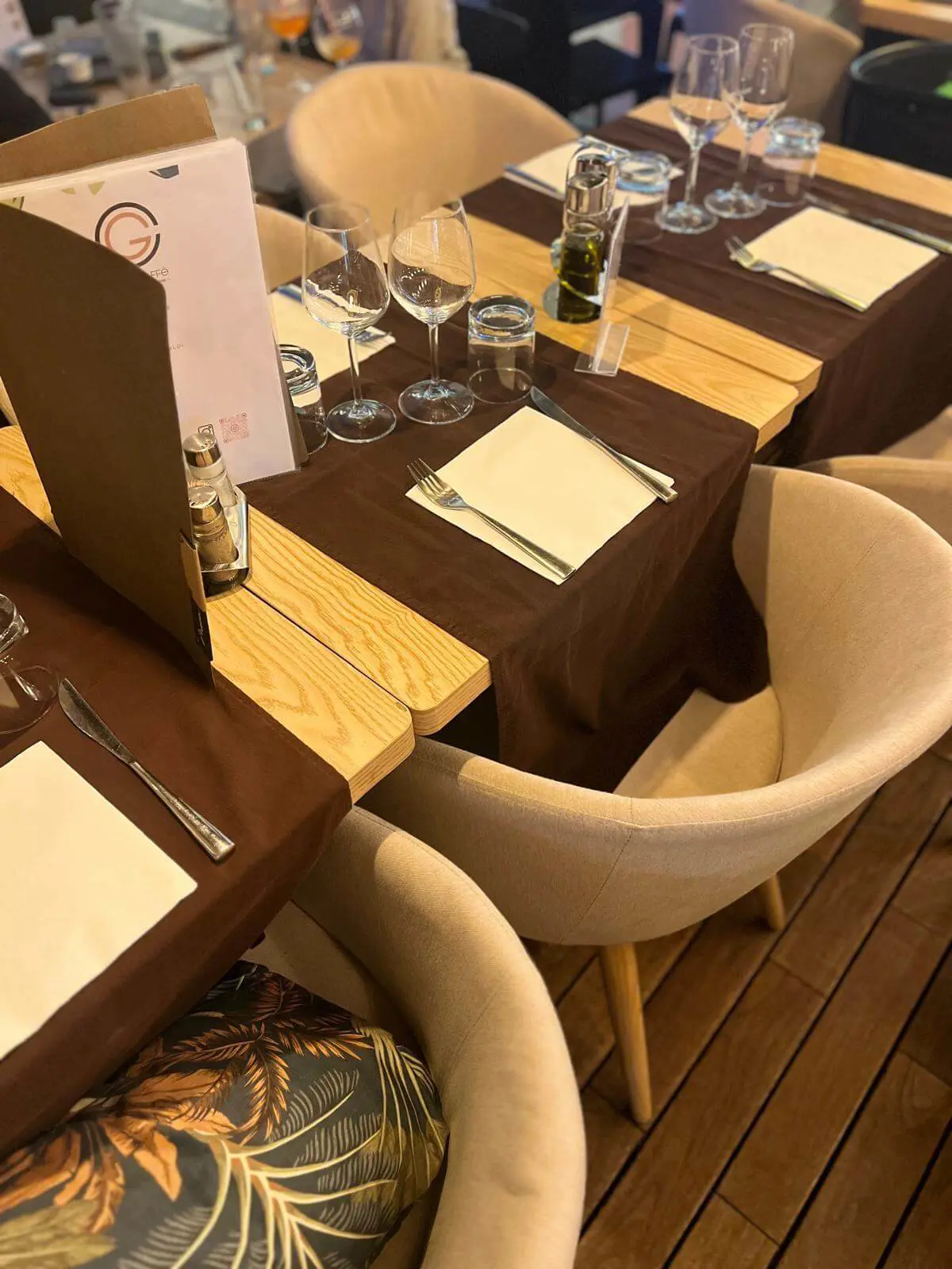 Elegant dining table setup with candles and cutlery