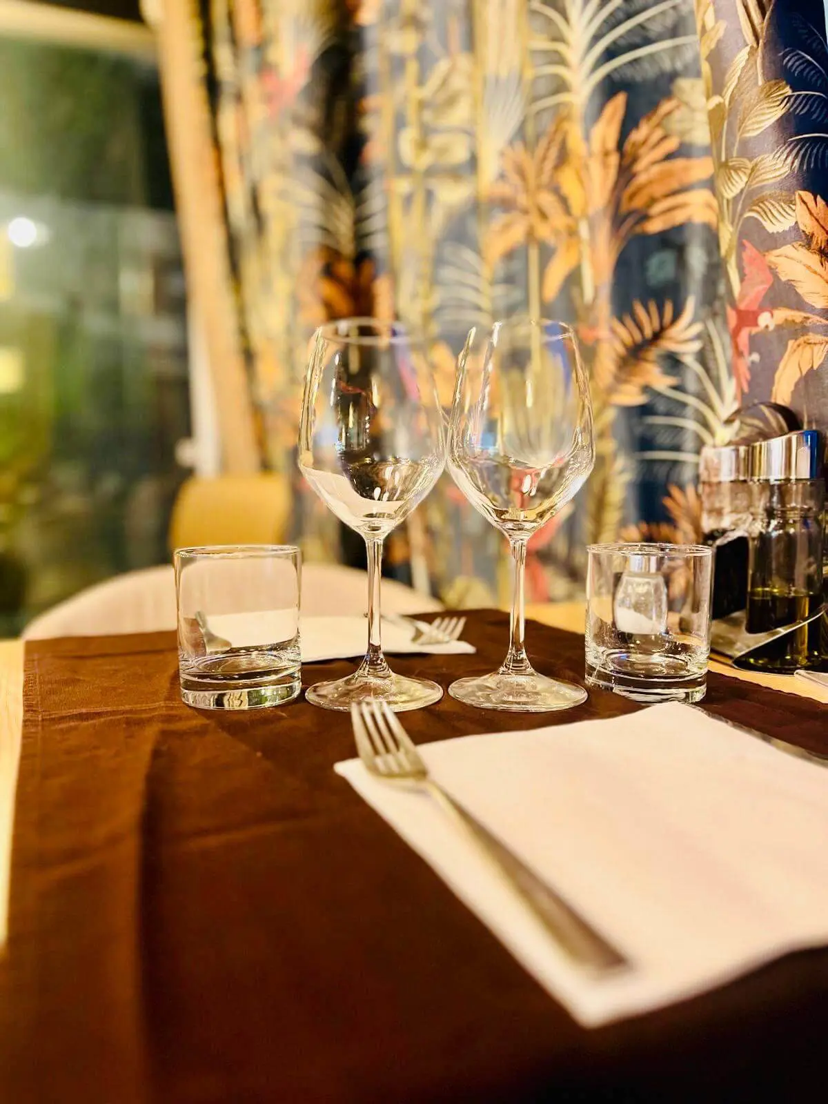 Outdoor patio seating with string lights and plants